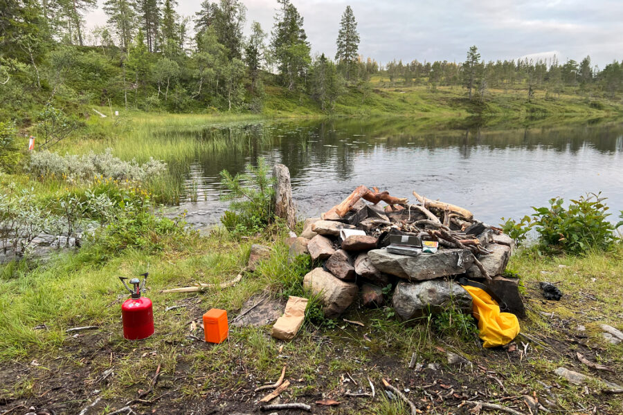 A fireplace next to a lake.